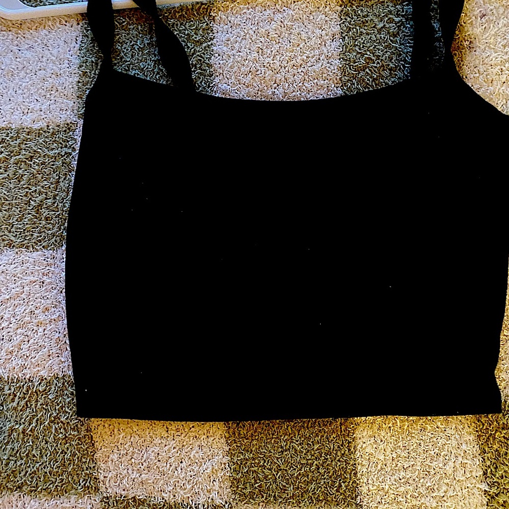 Forever 21 if you couldn’t read it it’s blurry black tank top